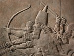 Detail of relief from the North Palace of Ashurbanipal, Nineveh, northern Iraq. The king is in his chariot shooting arrows at succession of lions (ME&nbsp;124867)
